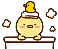 Cute yellow chick with a tiny duck on its head, resting its wings on a brown table.